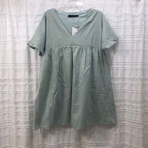 Babydoll dress in a sage green/turquoise.